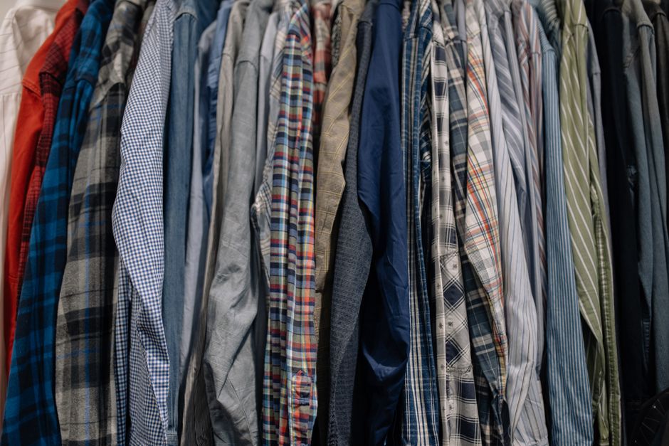 Shirts neatly hanging in a custom closet organizer